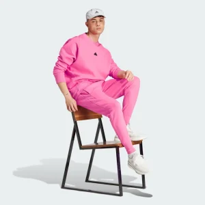 Conjunto Adidas rosa para mujer, estilo atrevido y cómodo para el día a día.